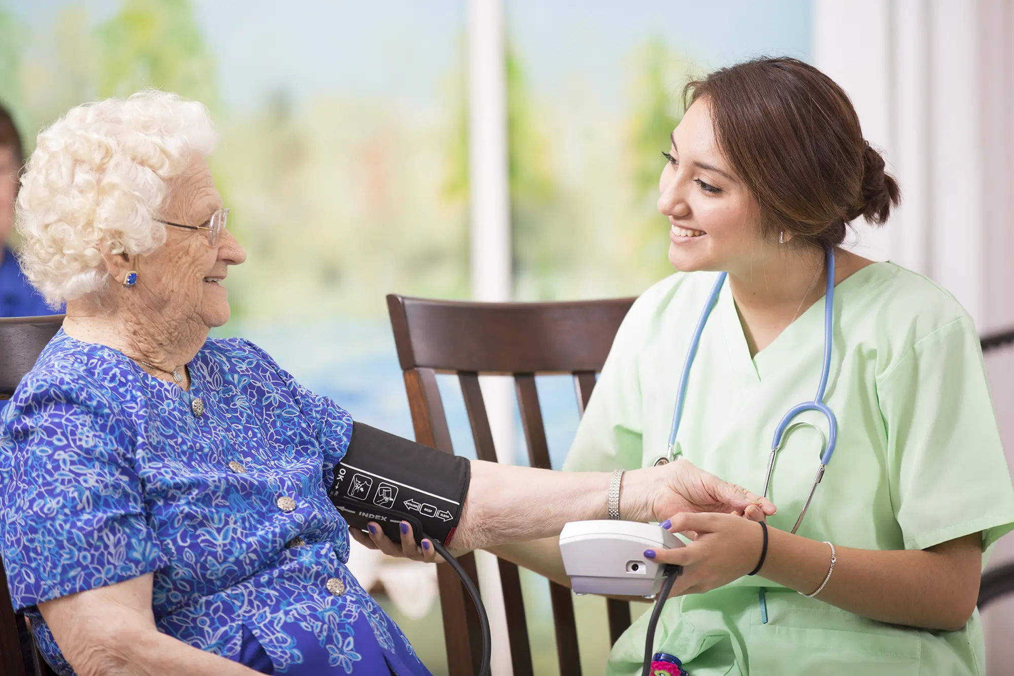 SALMON VNA nurse taking a patient's blood pressure