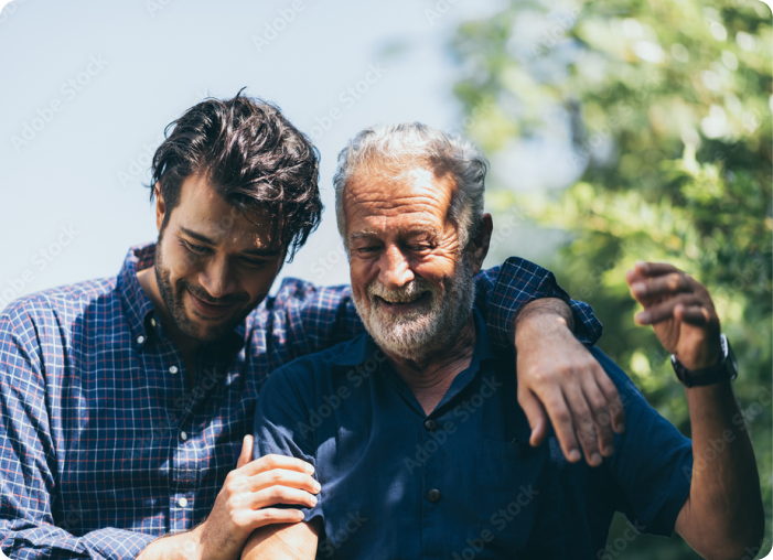 Elder son and Senior father walking through a park
