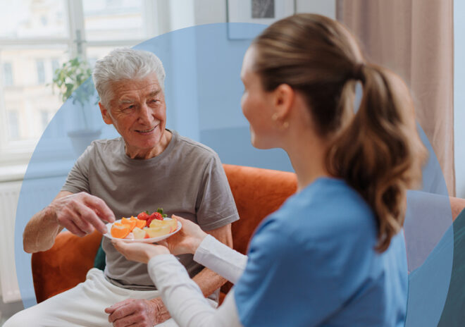 caregiver serving fruit to senior resident v2