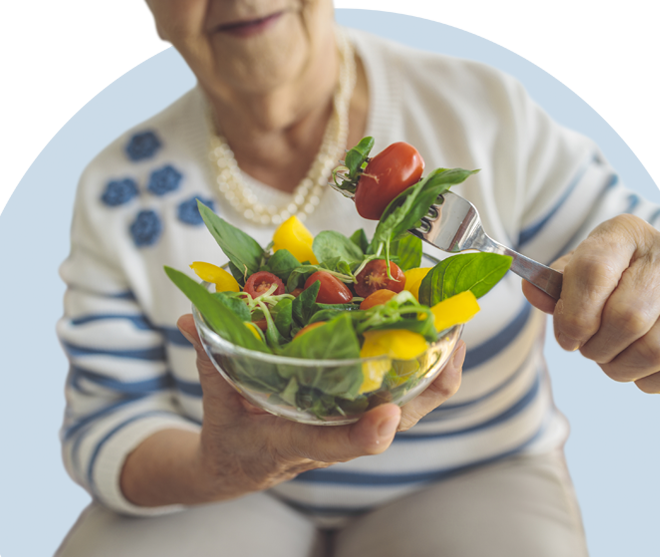 senior woman eating salad