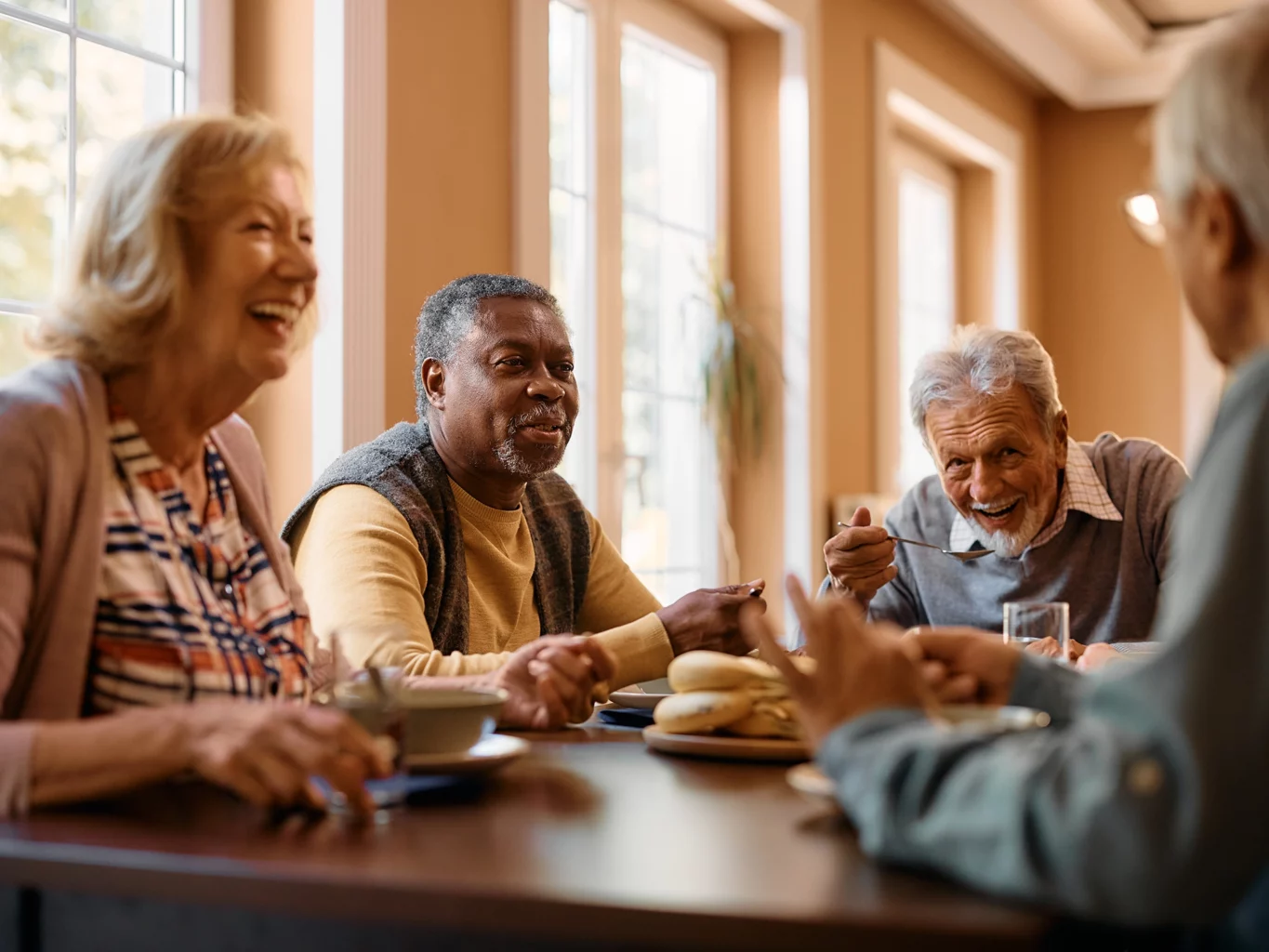Senior friends eating lunch at a SALMON Dine and Discover event