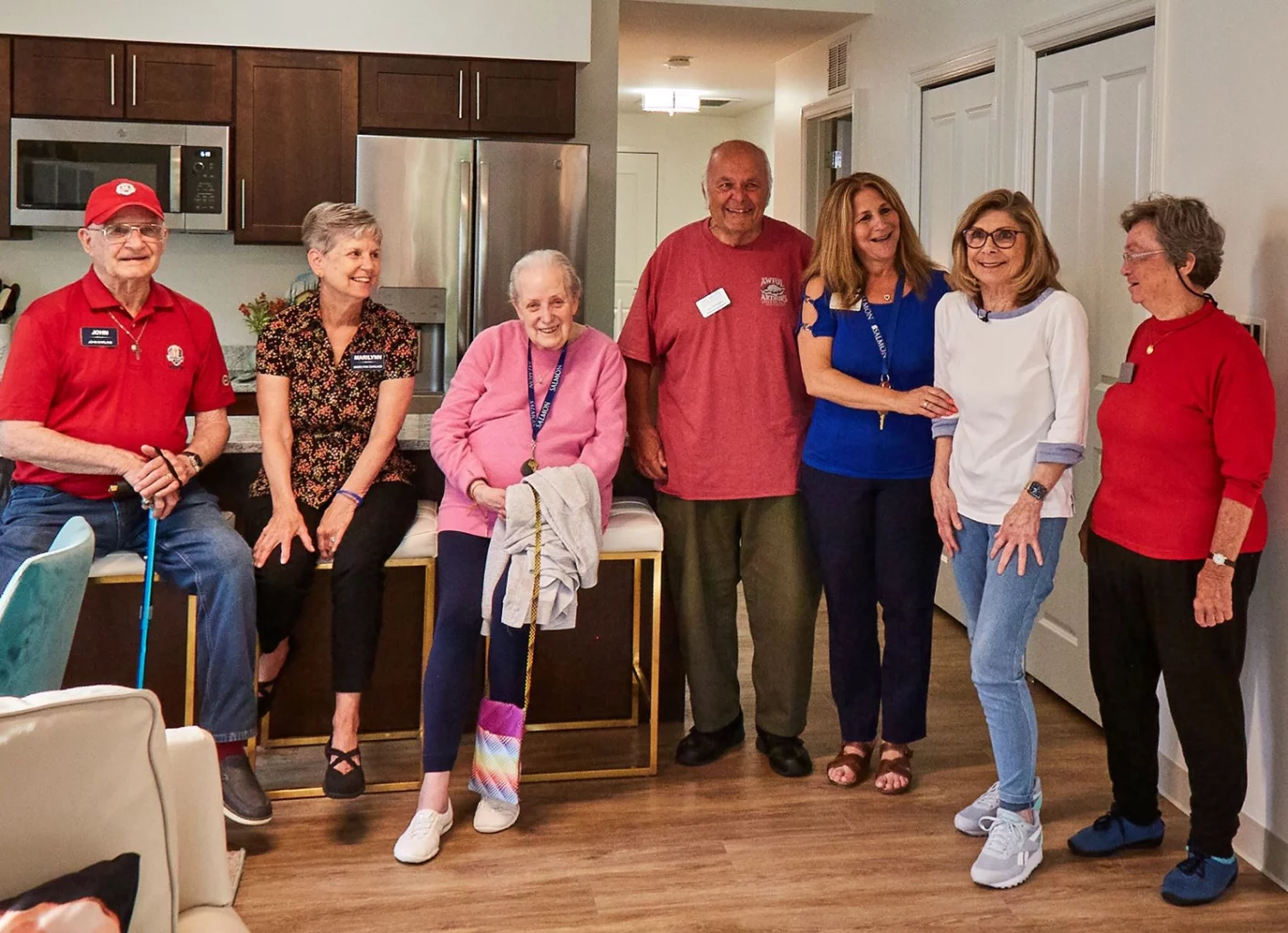 Group photo of a happy resident moving into their new SALMON The Willows residence