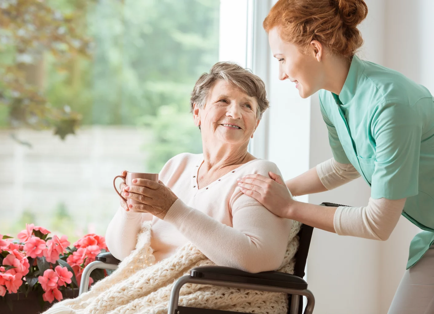 SALMON Health and Retirement staff member providing private care to a senior woman at home