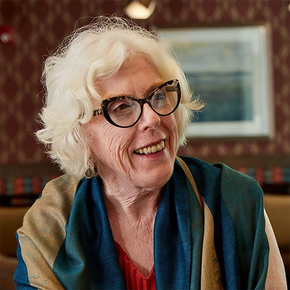 Senior woman with glasses and scarf