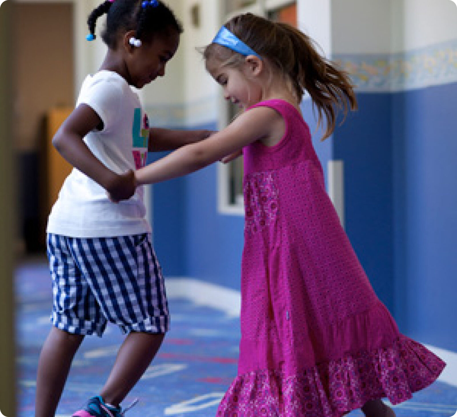 two young girls dancing at SALMON's Early Education Center at Natick