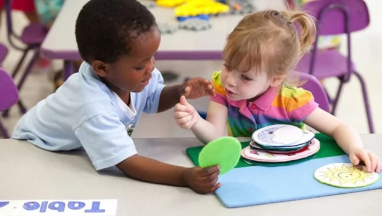 Young boy and girl playing with play-dough