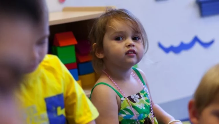 young girl smiling at the Early Education Center at Natick