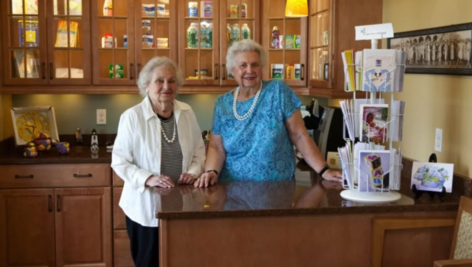 Two senior women at the SALMON at Natick Whitney Place convenience store
