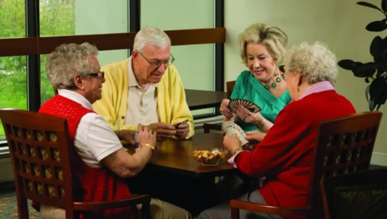 SALMON at Westborough The Willows residents playing cards in the common area