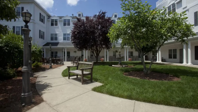 SALMON at Westborough Whitney Place outdoor space with a bench